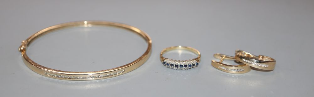 A modern 9ct gold sapphire and diamond ring, a modern 10k and diamond bangle & earrings.